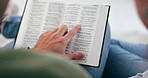 Bible, hand or couple reading book in prayer, support or hope in Christian home to worship together. Closeup, woman or man studying, learning or asking God for grace in religion with love or care