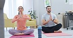 Fitness, breathing and couple doing yoga in the living room together for body, mind and spiritual wellness. Calm, meditation and young man and woman doing a zen pilates exercise in the lounge at home