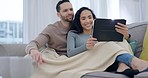 Tablet, couple talk and home with tech and film streaming with love and care on sofa. Living room, website and watching movie online with young people together in lounge with social media app scroll