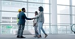 Business people, architecture and handshake for construction meeting, welcome and building deal in modern office. Men, women and shaking hands for engineering collaboration and contractor partnership