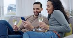 Man, woman and champagne on sofa, phone and happy for party, celebration and relax with video on mobile app. Couple, drink alcohol and together for chat, social network or meme in home living room