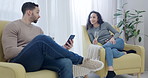 Man, woman and champagne in lounge with phone at a party, celebration or relax at event with social media, mobile app or news. People,, drink alcohol and together in conversation in home living room