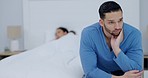 Divorce, stress and man on a bed with depression, anxiety or snoring problem in a house with insomnia. Marriage, conflict and couple in a bedroom fighting, ignore or frustrated by infertility crisis