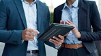 Hands, tablet and business people planning in the city together for collaboration on a project. Meeting, partnership or teamwork with an employee and colleague talking about tech research closeup