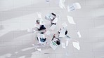 Documents, top view or excited business people throw paper into air in meeting, victory or deal. Winning, wow or happy team in celebration of target, growth success or goal with office paperwork