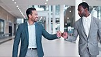 Office, walking or happy business people fist bump in celebration of a deal success, target or goal. Employees, handshake or excited men on break after teamwork, partnership or bonus achievement