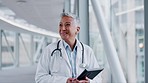 Doctor, walking and a woman greeting in a hospital with tablet for research, results or schedule. Happy medical staff, health care and person with tech in lobby for hello, smile or kindness to people