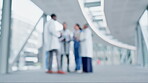 Teamwork blur, group or doctors in meeting for hospital planning or discussion for collaboration. Community, help or nurses talking or speaking of healthcare research, report data or emergency news