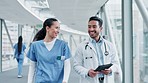 People, doctor and tablet walking in healthcare, discussion or planning together at the hospital. Man and woman medical professional with technology for health service, results or teamwork at clinic