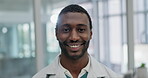 Doctor, happy and face of black man in hospital for medical, professional and consulting. Medicine, healthcare and wellness with portrait of person in clinic for smile, pharmacist and surgery