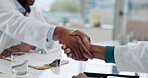 Handshake, medical doctor and team in hospital for collaboration, partner or thank you. Shaking hands, patient or people consulting for advice, opinion or trust on agreement with congratulations