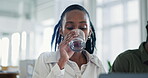 Water, smile and a black woman with a laptop and coworking in an office for a project. Happy, corporate and an African employee with a drink while typing on a computer with a worker in a workspace