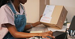 Laptop, box and black woman typing in shipping, ecommerce and small business. Computer, stock and person post package in delivery, logistics or online cargo, reading label and order info in office