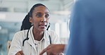 Woman, doctor and consultation in a hospital or healthcare clinic with conversation and care. African female person, communication and medical professional with a patient and wellness advice work