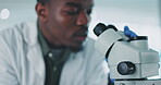 Black man, scientist and microscope, analysis in laboratory with medical research and check sample in experiment. Future, doctor and investigation with scientific study and learning with pathology