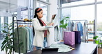 Retail, shopping and woman in fashion at a store style choice for clothing on sale, discount or promotion in a boutique. Service, customer and calm person with decision on wardrobe product to relax