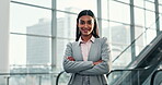 Face, happy and arms crossed with a business indian woman in an office or airport for an international trip. Portrait, smile and confident with a young employee in a corporate workplace for travel