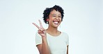 Face, smile and woman with peace sign, excited and happiness on a white studio background. Portrait, person and model with hand gesture, v symbol and winking with motivation, emoji and feedback