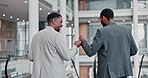 Fist bump, business men back and happy handshake at office escalator with teamwork and work support. Smile, friends and motivation of web analyst workers excited with celebration from collaboration