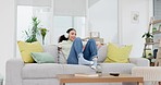 Music, headphones and woman relax on a sofa with radio, streaming or playlist in her home. Podcast, earphones and female person in a living room with audio, resting and chilling with weekend freedom