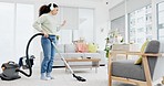 Cleaning, dance and woman with vacuum, music and headphones for fun at home on the weekend. Housekeeping, earphones and female dancing to radio, podcast and spring clean her house with dust machine