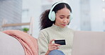 Credit card, payment and woman on laptop in home and online shopping, website or internet transaction on sofa. Girl, typing info and banking details on computer for paying, ecommerce or sale purchase