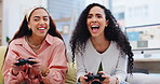 Friends, video game and women playing to win on home sofa for fun, competitive contest or esports. Gamer people with controller in lounge to celebrate with technology, funny bump and entertainment
