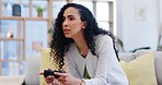 Woman on sofa playing video games, fun and relax in living room of home with internet, controller and streaming. Online gaming, esports and young gamer girl on couch with virtual subscription service