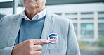 Hands, vote pin and man in USA referendum for American democracy. Election, badge and person in support of choice, decision and pointing to government in politics, party and state administration.