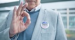 Ok hands, vote pin and man in USA referendum for American democracy. Okay, election badge and person point to choice, decision or support of government in politics, party and state administration