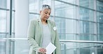 Vote, election and senior woman with a ballot in a box for democracy politics in America. Anxiety, poll station and stressed elderly female person with a paper for government decision in a building.