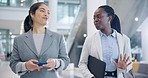 Lawyer, women talking and walking in office lobby, company or workplace. Happy, attorney team and employee in conversation, communication or discussion for planning business project together at hotel