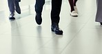 Walking, shoes and floor of a company with business people for work in the morning as a group. Team, office and legs and feet of employees in the workplace together for a corporate career or job