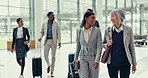 Business people, travel and walking with suitcase at office for international team collaboration or meeting. Happy group of employees talking on work trip in teamwork, global company or building