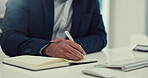 Businessman, hands and writing in book for schedule, planning or notes and reminder on office desk. Closeup of man or employee with notebook in project plan, strategy or brainstorming at workplace 