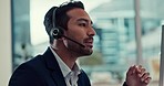 Talking, online and a man in a call center with a computer for telemarketing and technical support. Smile, contact us and an Asian customer service employee speaking on a consultation for advice