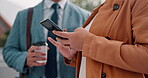 Hands, phone and collaboration with a business woman typing a text message outdoor in the city closeup. Teamwork, mobile or contact and an employee with a colleague outside for communication 