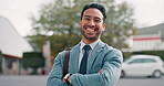 Arms crossed, smile and business man in city for professional, manager and pride. Happy, creative and entrepreneur with portrait of person in New york street for confidence, positive and satisfaction