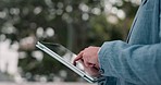 Business, outdoor and hands with a tablet, man and typing with social media, connection or communication. Person, closeup or professional with technology, outside or contact with website information 
