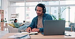 Man, planning and work from home on laptop, headphones and notebook for marketing ideas and music. Young worker writing notes, listening to audio and computer in living room for freelance opportunity