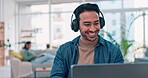 Man, work from home and headphones for music, mental health and happy career, online planning and project. Young worker, employee or freelancer listening to audio or streaming service on his computer