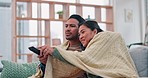 Happy, couple and on the sofa, watching tv and talking in the living room of a house. Smile, together and a comfy man and woman with a remote for a show, movie or conversation on the couch with care