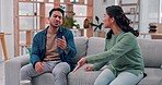 Couple, divorce and argument, fight or talking in marriage crisis at home on living room sofa. Asian man, woman and anger in cheating mistake, frustrated or conflict to challenge in relationship fail