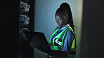 Laptop, database and cybersecurity with a black woman in a server room for maintenance or repair at night. Computer, software and storage with an it engineer working on information technology safety