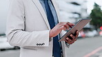 Business man, hands and tablet in city for planning online report, reading news app and research information. Closeup of corporate worker, digital tech and review network on internet in urban street 