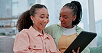 Couple of friends, tablet and women on a home sofa for funny video, website and internet. Relax, lesbian people and talking on a couch with technology for communication, search or social media