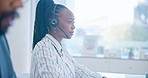 Black woman, call center and typing on computer in customer service, support or telemarketing at the office. African female person, consultant or agent in online advice, admin or help at workplace