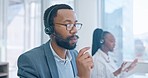 Customer service, support and a black man consultant talking in a call center for online assistance. Contact, marketing and headset communication with an employee consulting in a telemarketing office