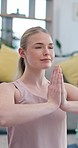 Yoga, meditation and prayer pose, woman in home, chakra health and mindfulness training in living room. Balance, calm breathing and workout, girl in holistic exercise for peace and zen in apartment.