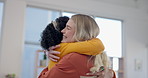 Women, happy lesbian couple and hug in home in care, kindness and commitment. Love, embrace and gay girls smile in living room in trust, romance and interracial support for bonding in house together